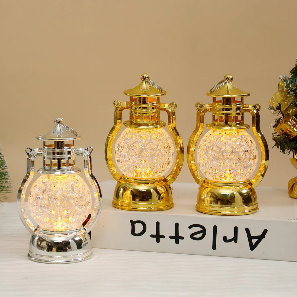 Retro oil lamp style LED night light in gold or silver finish measuring 14.5cm tall