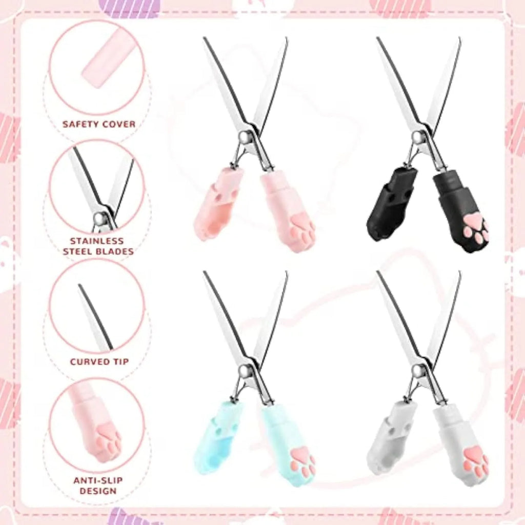 Set of four mini folding scissors with cat paw design in black, blue, pink, and white colours on a plain surface.
