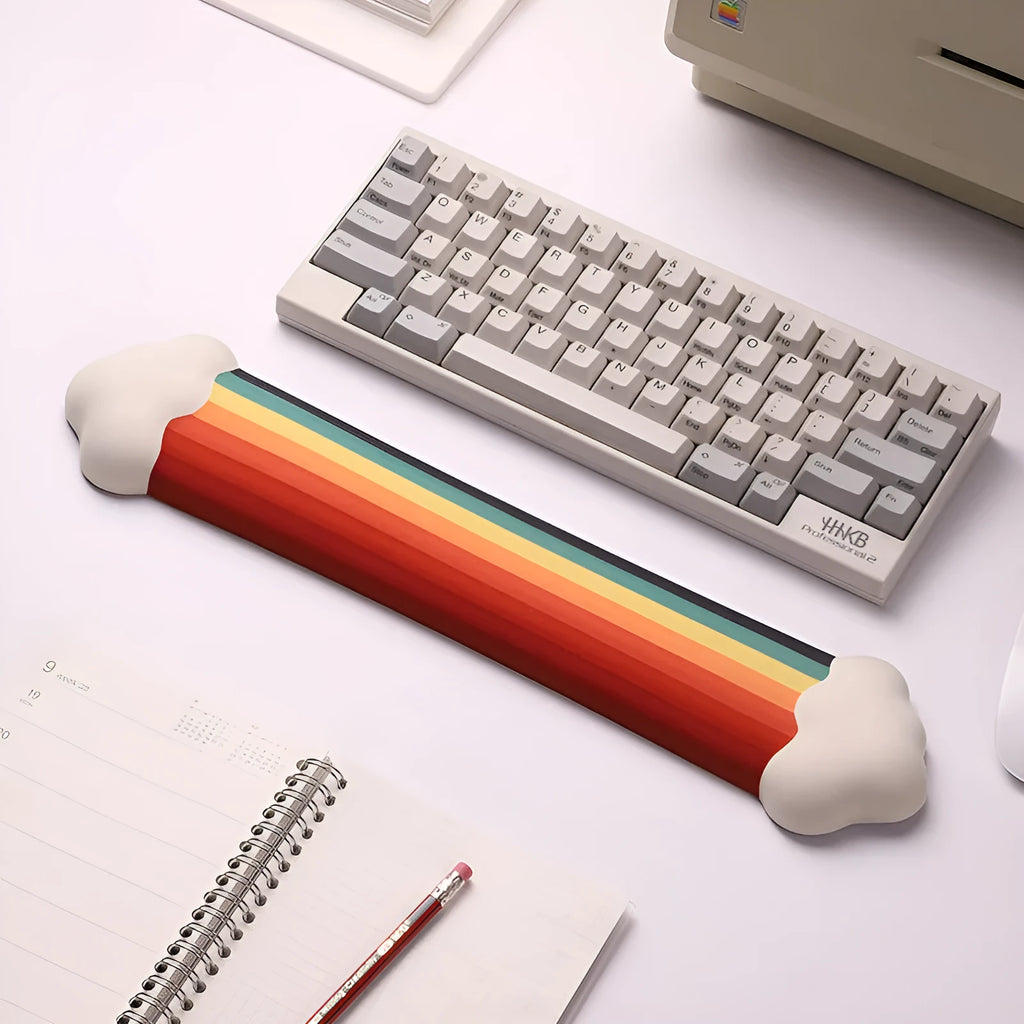Silicone wrist rest mouse pad and keyboard holder set with cloud pattern on a desk.