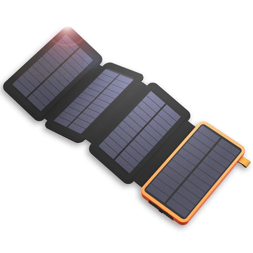 Outdoor solar power bank in black with a solar panel, soft leather finish, and LED light on a grassy field.