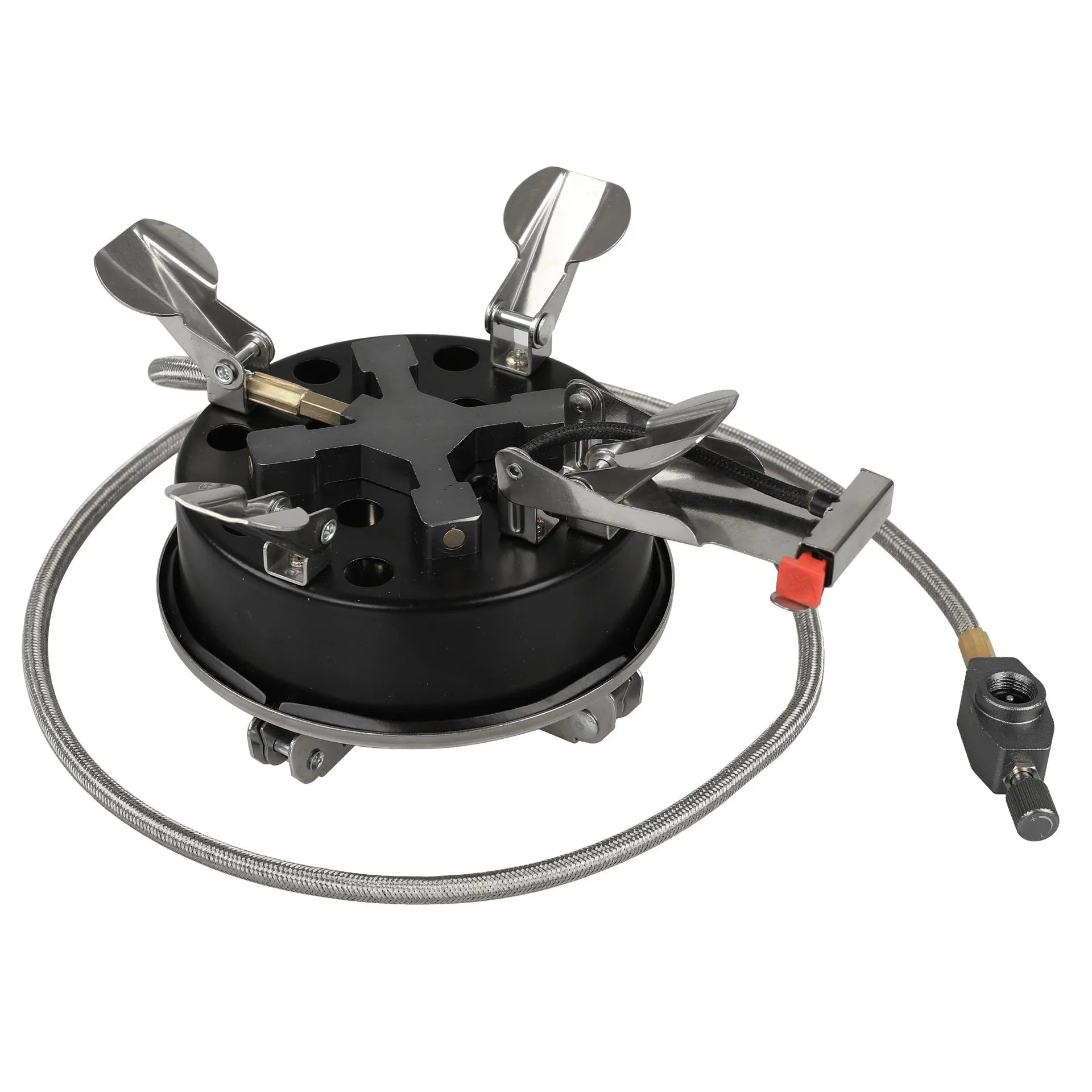 Silver portable folding camping stove with extended copper gas hose, shown on a wooden picnic table.