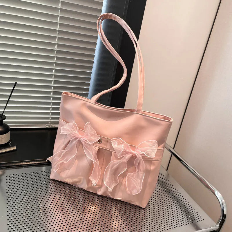 Black and pink college style bow tote bag with large capacity and double shoulder straps.