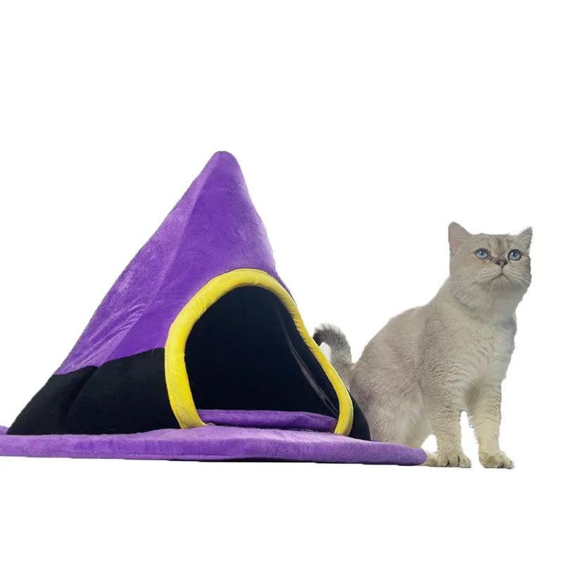Purple cloth Halloween witch hat shaped cat bed measuring 60 by 45 centimetres.