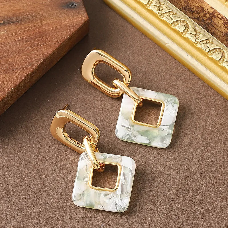 Hollow geometric square earrings with chamfered corners in electroplated copper