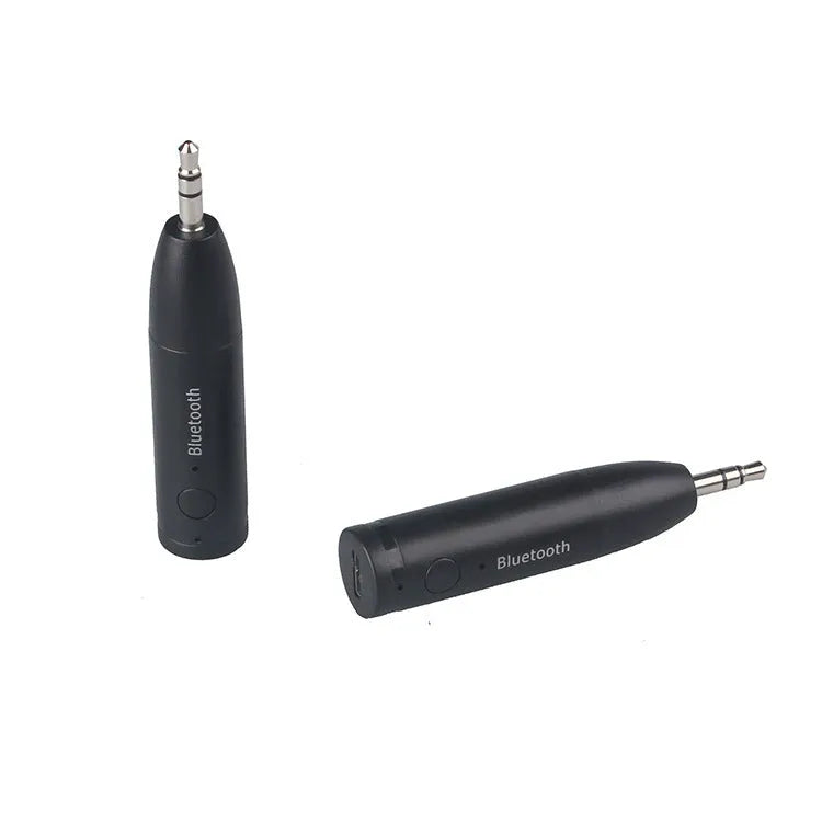 Black Bluetooth 5.0 audio receiver for car AUX or home stereo, shown with USB cable.