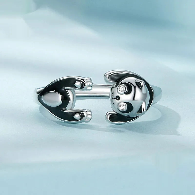 Cute Panda adjustable open ring in sterling silver with white gold plating on a finger.