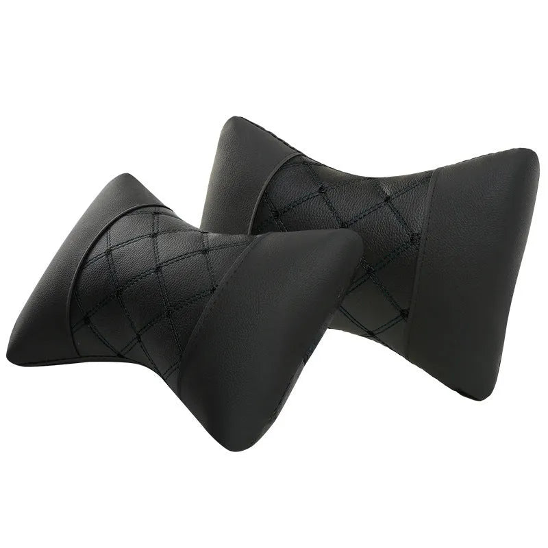 Black quilted diamond pattern car headrest pillow for cervical neck support.