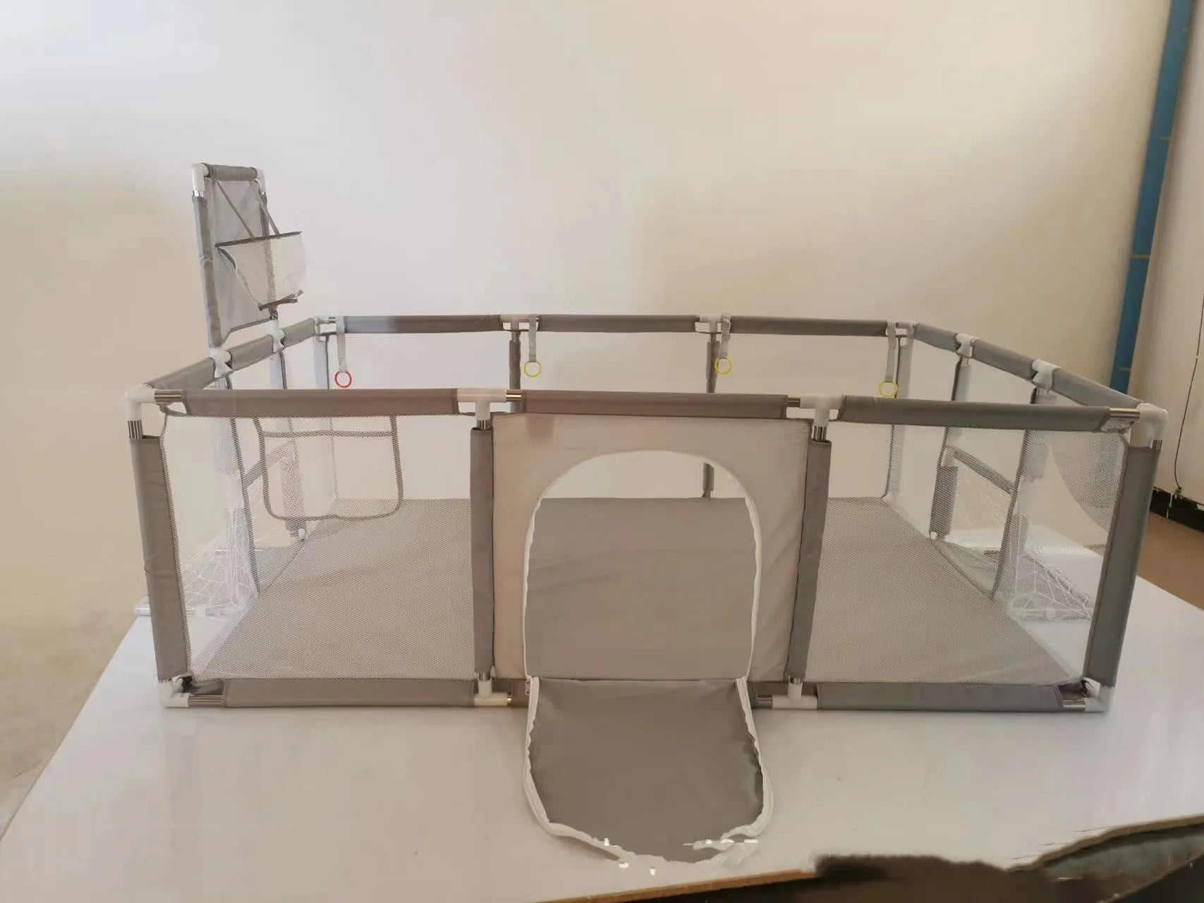 Large blue children's playpen tent with Oxford cloth walls and stainless steel frame in a nursery.