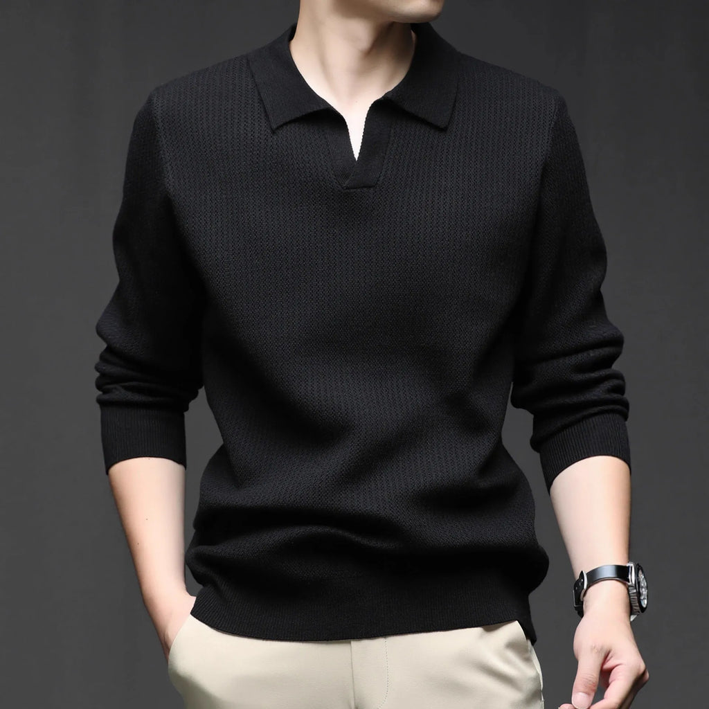 Man wearing a loose fit camel coloured casual pullover sweater.