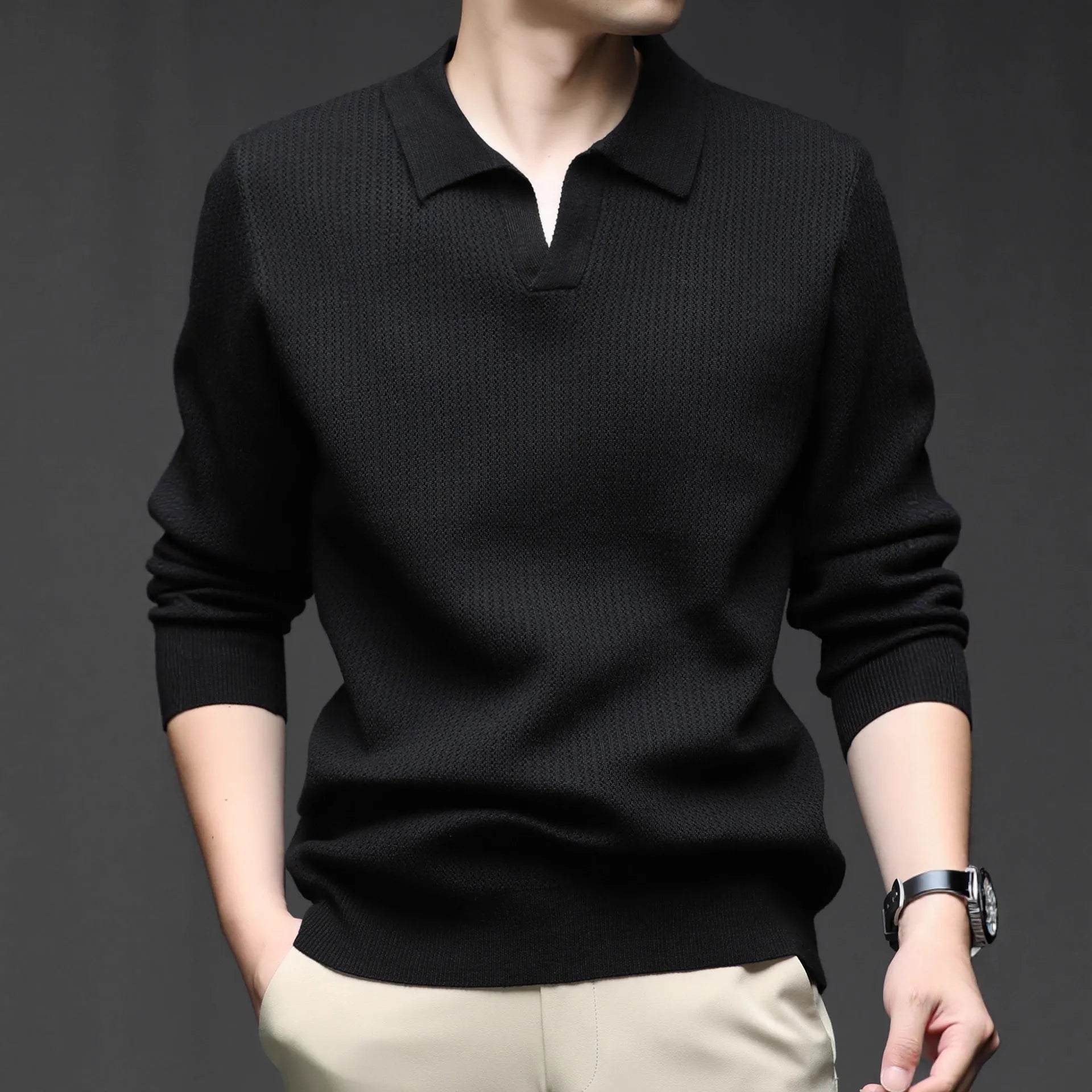Man wearing a loose fit camel coloured casual pullover sweater.