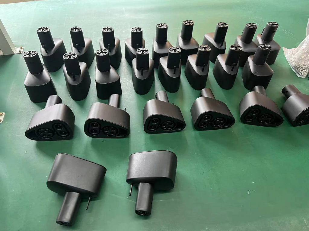Black Tesla charging plug conversion adapter with PC+nylon shell.