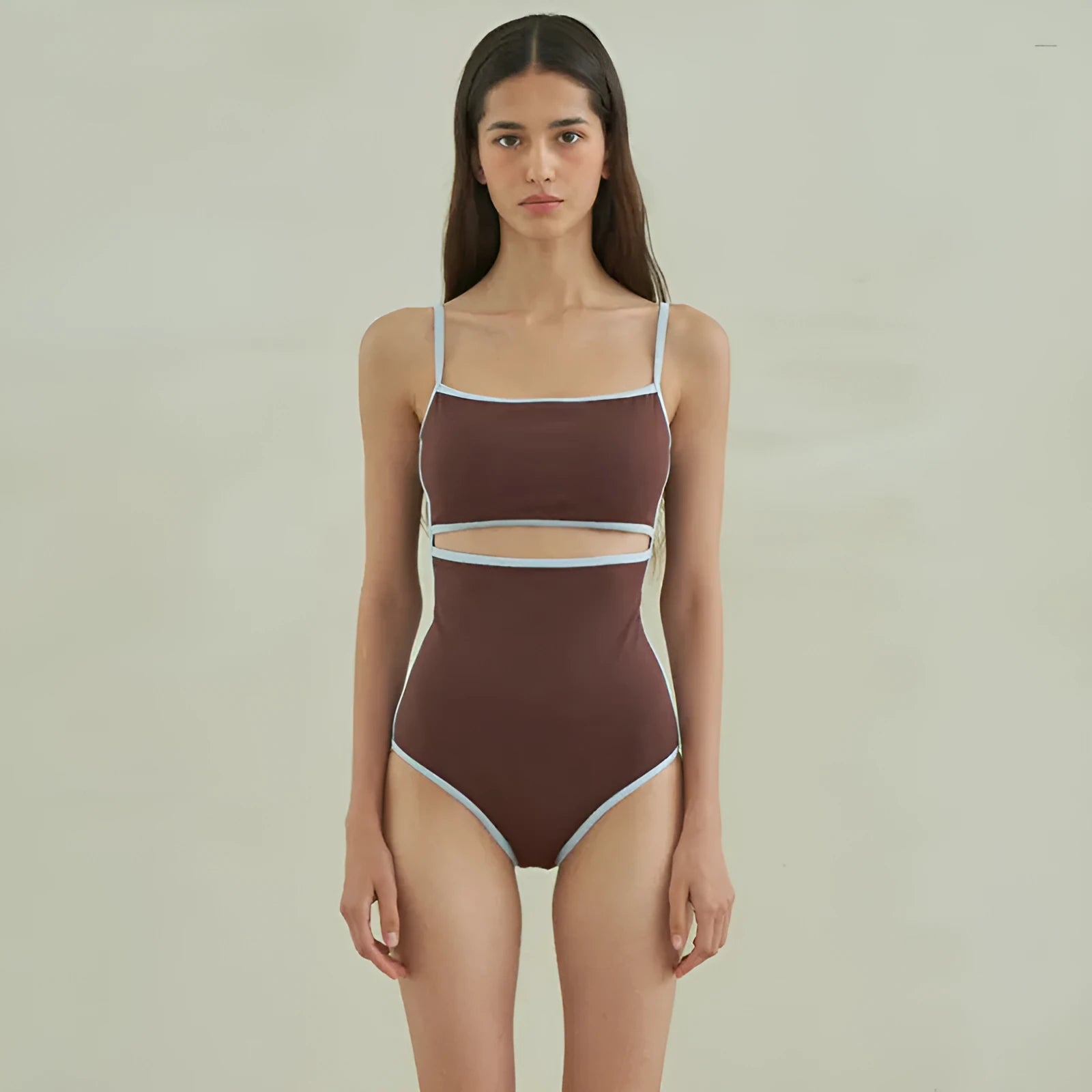 Brown women's one-piece triangle swimsuit made from nylon fabric on a mannequin.