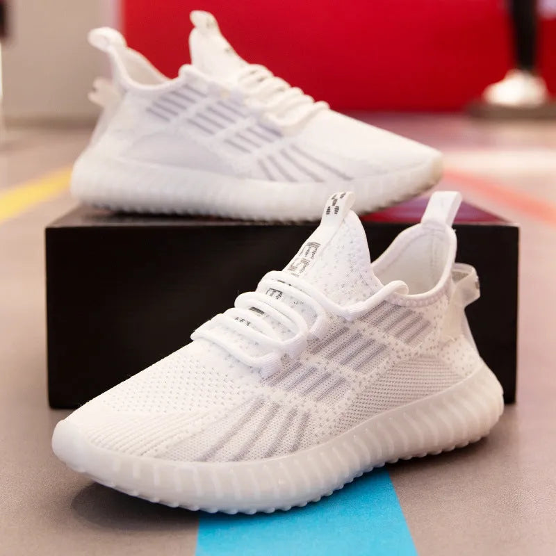Men's breathable flying fabric sports shoes in white colour showing mesh lining and platform heel design