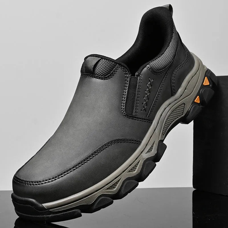 Men's dark brown casual leather shoes with a flat heel and round toe on a white background