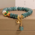 Blue jade abacus beads crystal bracelet with alloy inlay, rhinestone accents, butterfly charms and white agate beads