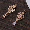 Micro inlaid zircon crown hollow water drop-shaped copper pendant in electroplated colour.