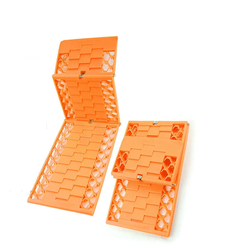 Orange folding vehicle rescue board showing rubber grip surface and folded size