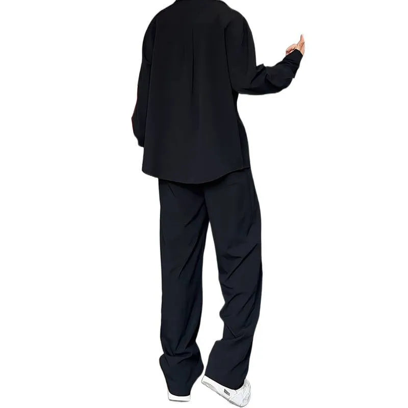 Men's black casual two-piece set with long sleeve polo shirt and trousers on a hanger