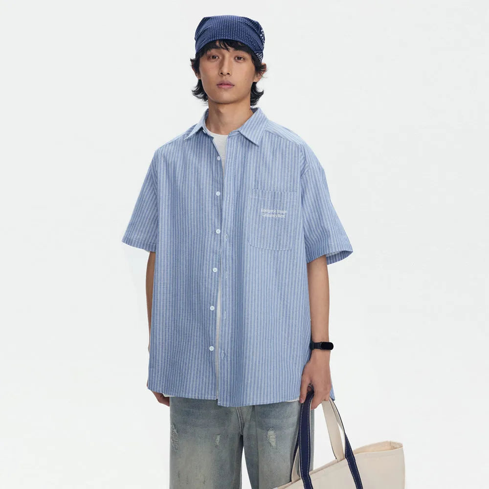 Blue striped loose fit overalls shirt with short sleeves and cardigan style design