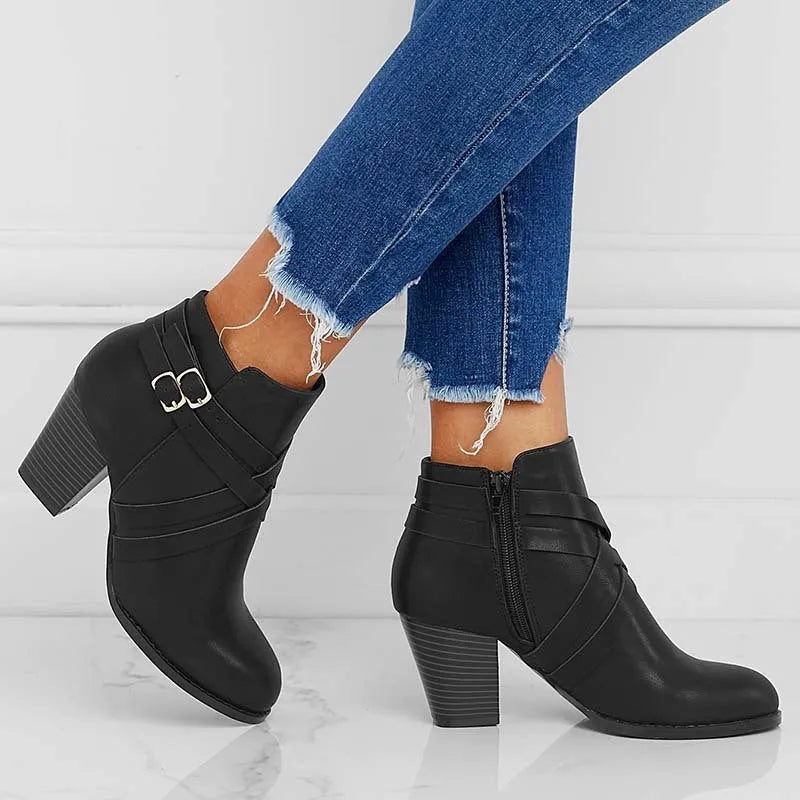 Plus size black short boot with side zipper, belt buckle, and a 7cm rubber heel