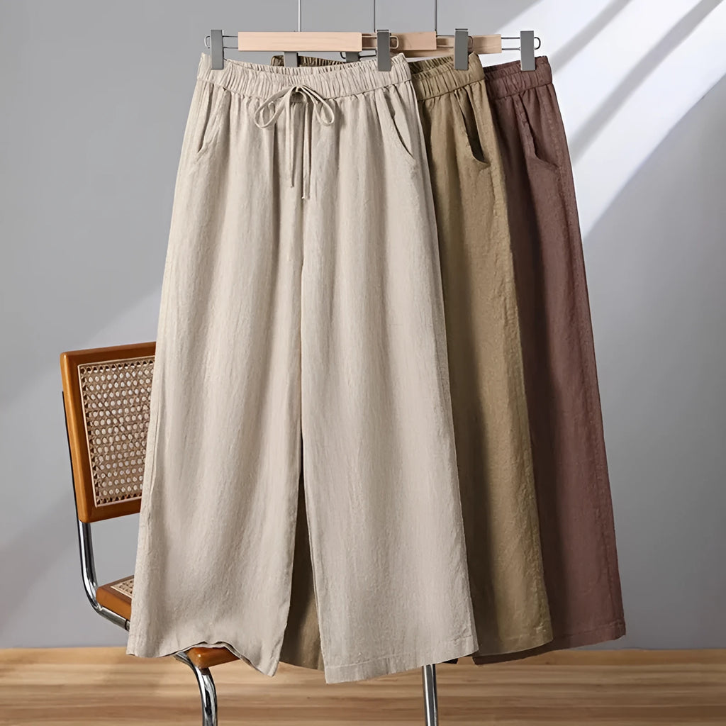 Women's straight-leg casual trousers in apricot colour with a drawstring elastic waistband and lace-up detail.