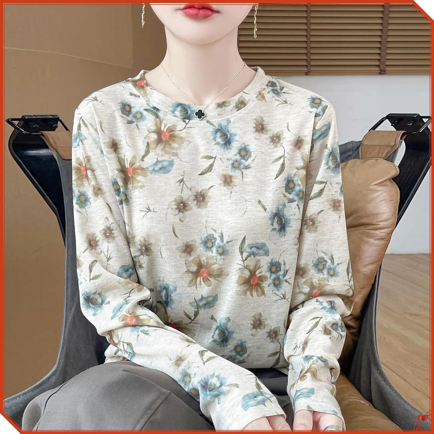 A women's round neck pullover in a Tencel cotton knitted fabric, shown in a printed colourway with regular sleeves.