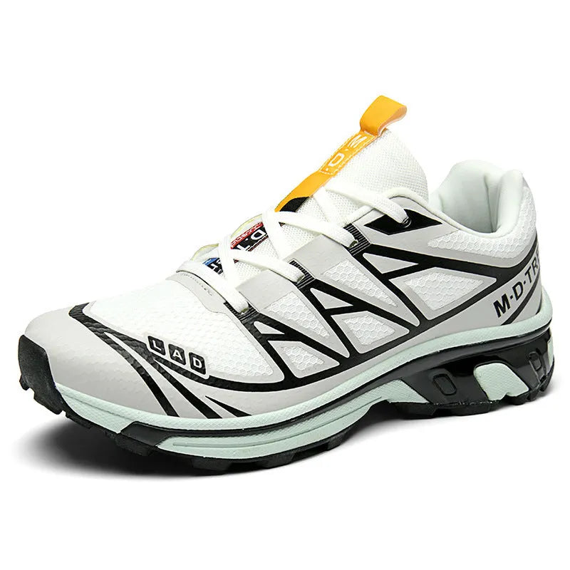Pair of low-top hiking shoes in artificial leather with a mesh lining and rubber sole.