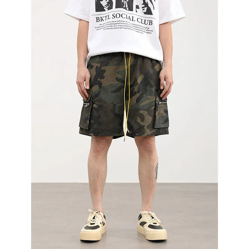 Men's camouflage work shorts with multiple pockets, cropped length and mid waist design