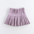Girls hollow retro pleated pantskirt in light gray purple cotton, front view, on child of about 90cm height