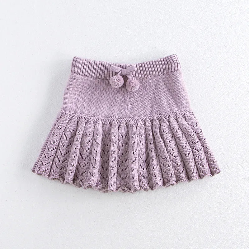 Girls hollow retro pleated pantskirt in light gray purple cotton, front view, on child of about 90cm height