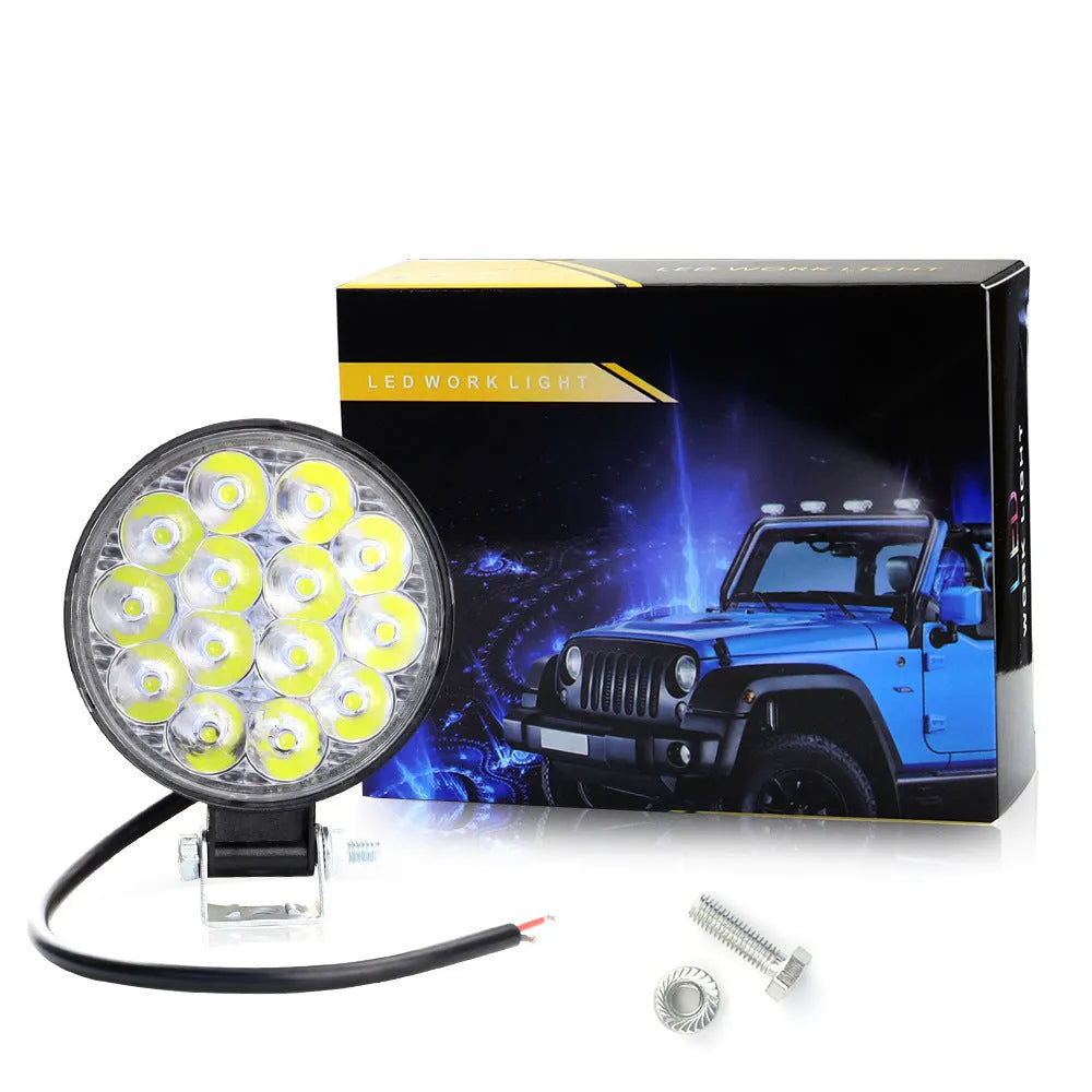 Compact round aluminium car LED work light with IP67 waterproof rating and 6000K white light output.