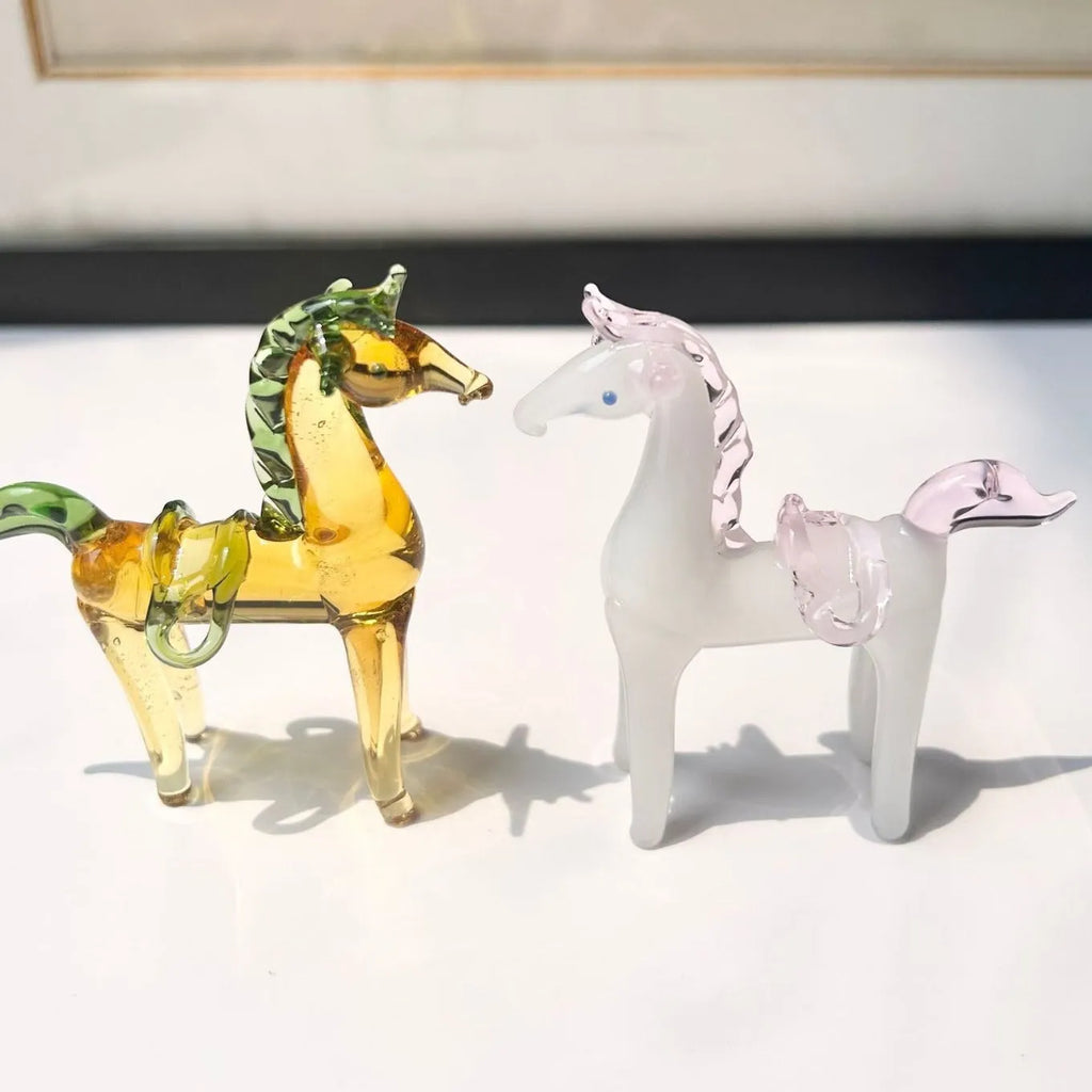 A smooth glazed horse figurine ornament in a modern minimalist style on a table.
