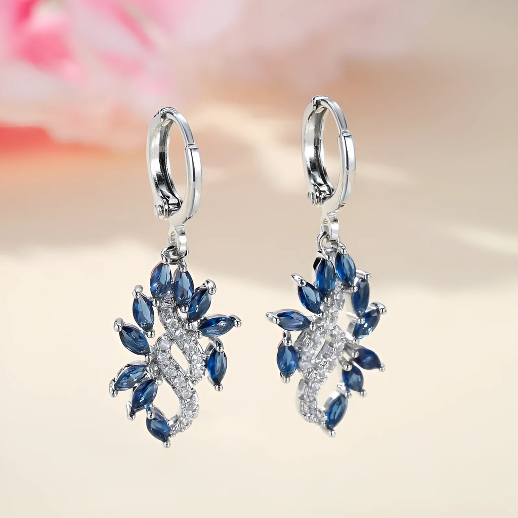 Women's alloy drop earrings with blue crystal stones in a platinum sapphire blue colour