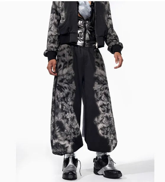 Unisex grey streetwear co-ord set featuring a printed hoodie, loose trousers, and seven-inch shorts laid flat