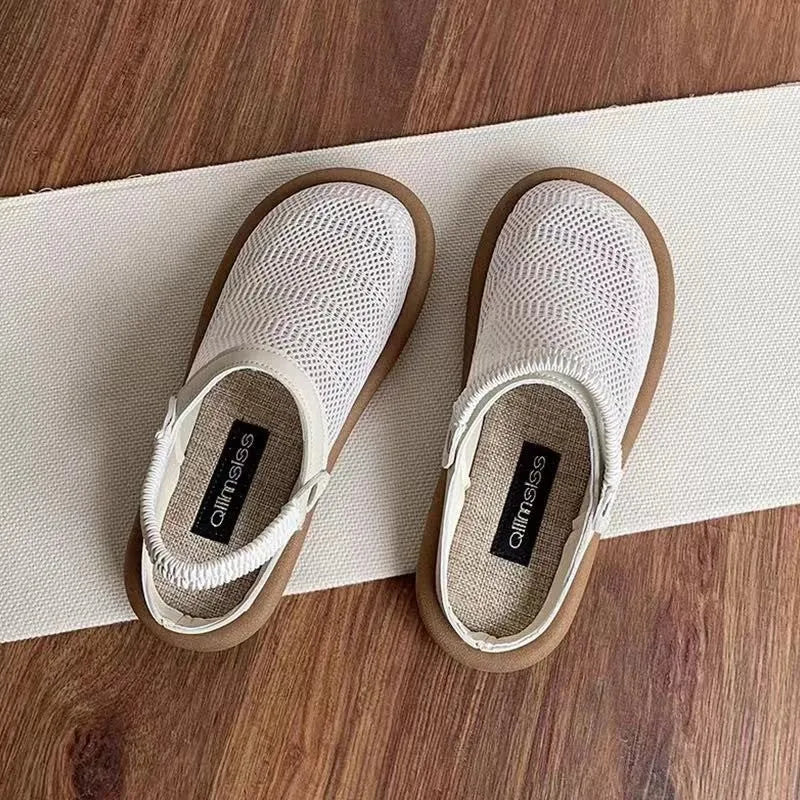 Beige linen slip-on hole shoes with mesh lining and a soft rubber sole, shown in a low-top style.