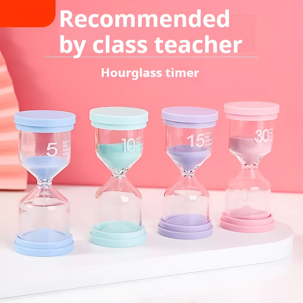 Handmade glass sand timer in blue colour showing sand flowing, on a wooden desk.