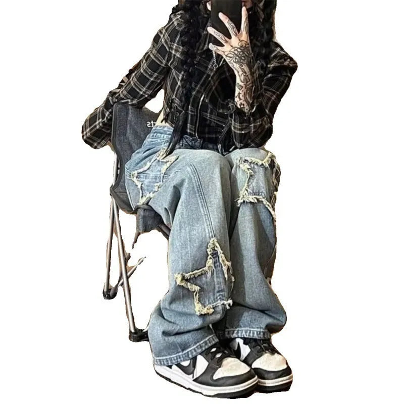 Blue women's high waist wide-leg denim jeans on a hanger, showing the straight leg cut.