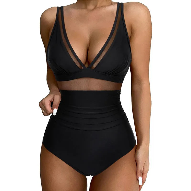 Black halter neck one-piece swimsuit with bikini style briefs, made from nylon fabric.
