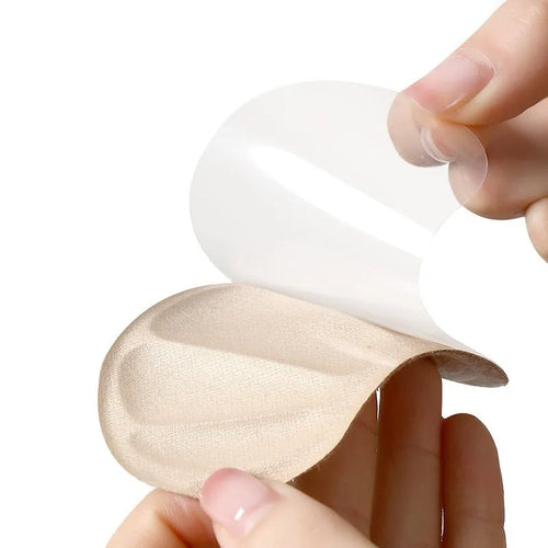 Camel-coloured suede heel cushion pads with adhesive backing for sneakers