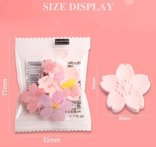 Assortment of cherry blossom decorated erasers in various colours from a bulk pack.