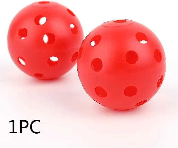 Multi-coloured 42mm golf practice balls with dimpled design in a net bag.