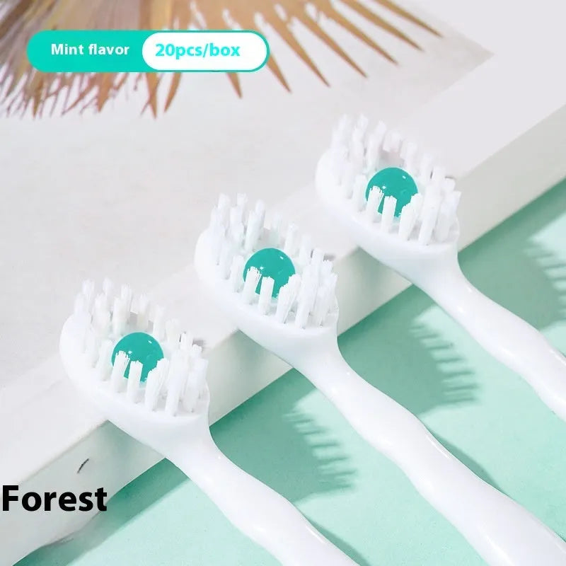 Box of 20 disposable beaded travel toothbrushes in individual wrappers.