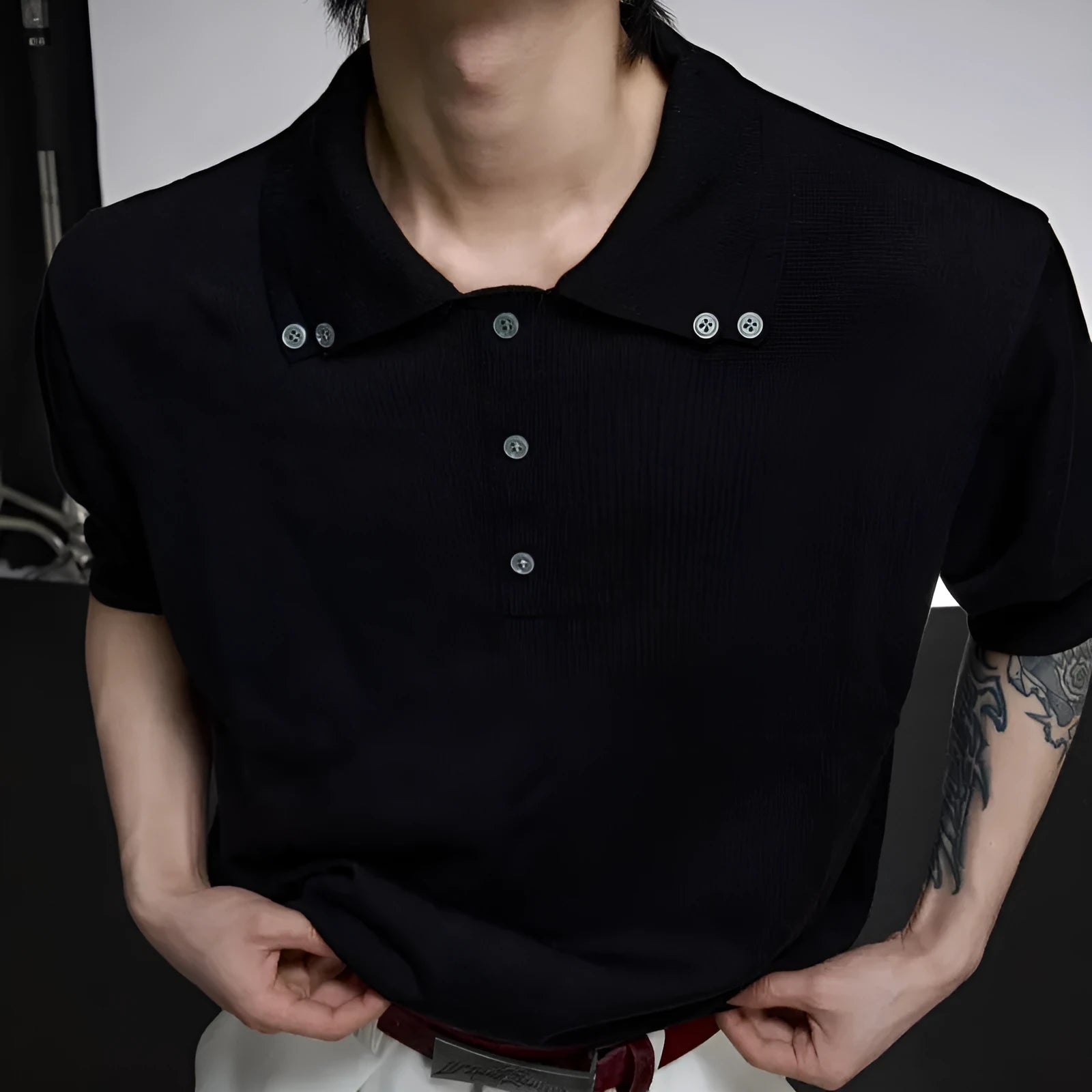 Men's black slim knit short sleeve shirt with double collar design and fastener decoration