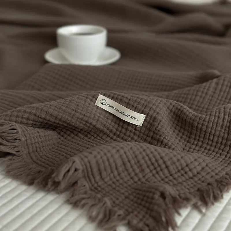 Four-layer cotton gauze blanket with tassel trim in navy blue colour