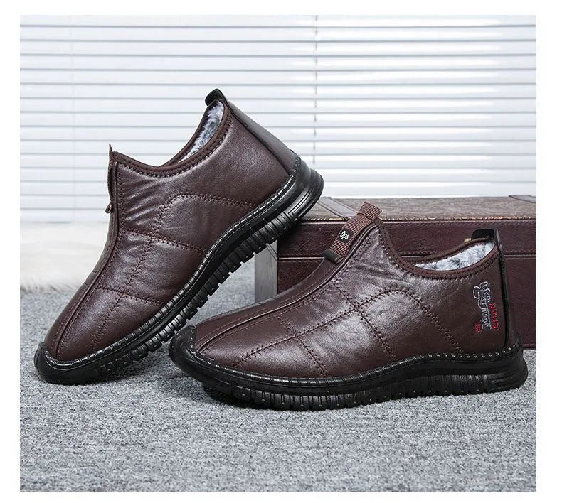 Men's brown buckle-up winter boots with a cotton upper and thick sole on a white background.