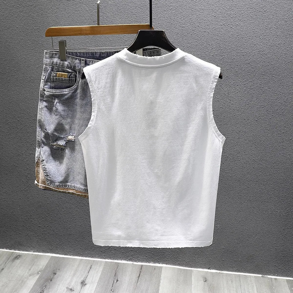 A solid colour loose-fitting cotton sleeveless T-shirt with a straight hem, shown in white.