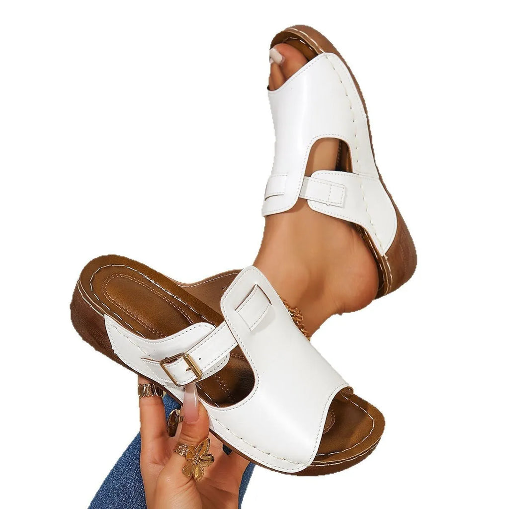 Women's light pink magic stick slippers with fish mouth open toe design on a white background
