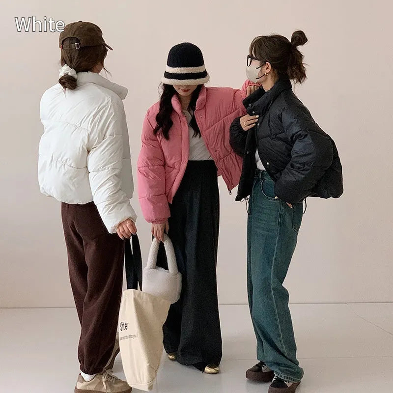 Women's loose thick polyester padded coat with zip front, available in seven solid colours and sizes S to L