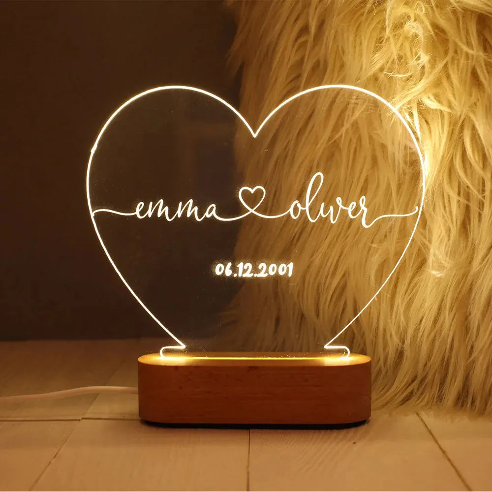 Custom acrylic LED night light with engraved names and date for Valentine's Day.