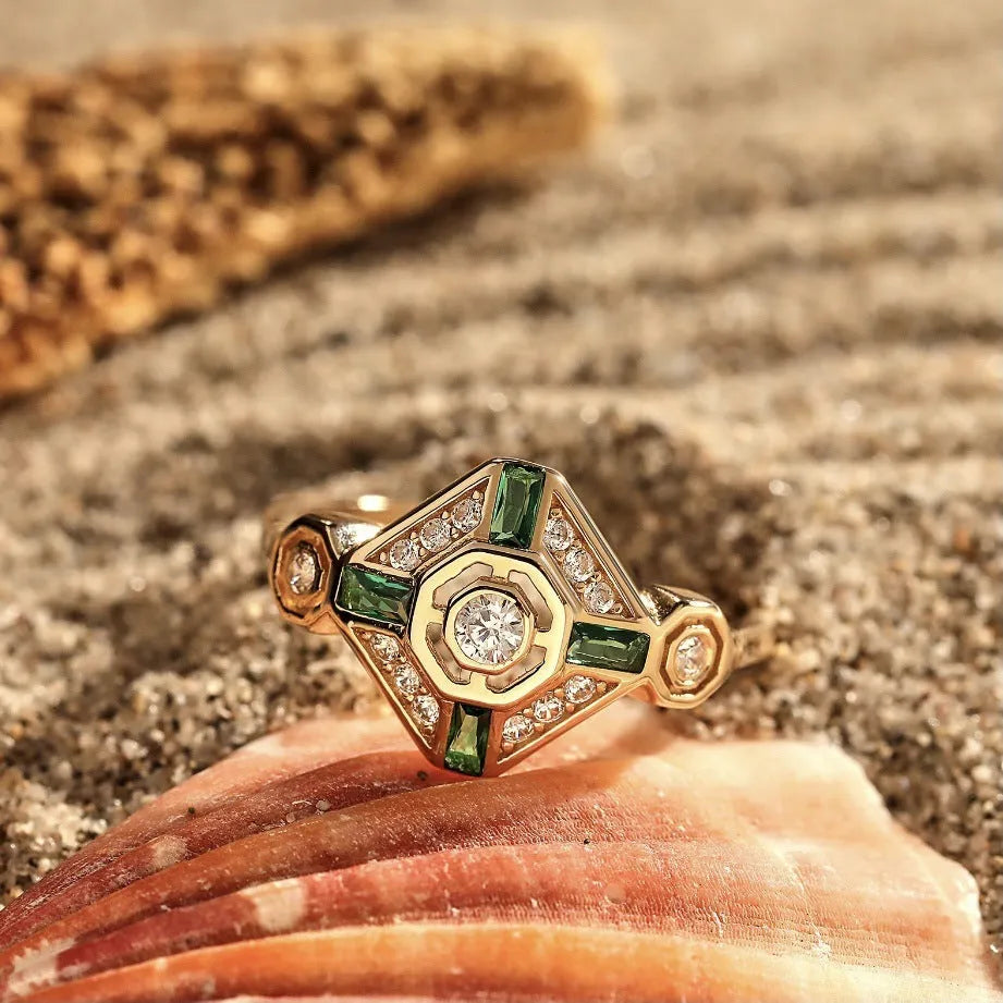 Square cut emerald diamond women's fashion ring with a lvzuan green stone on a silver electroplated band.